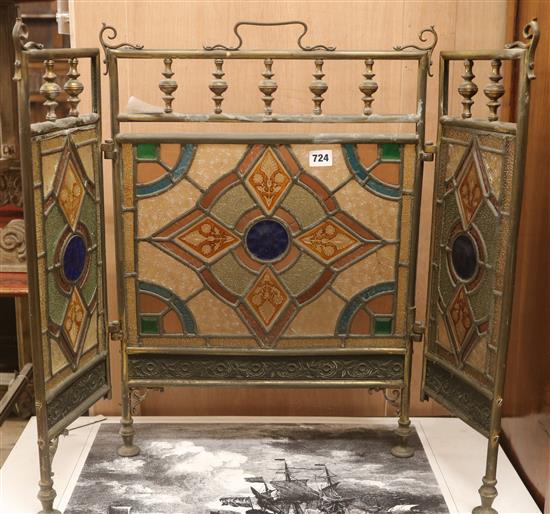A 3 fold stained glass brass firescreen H.63cm